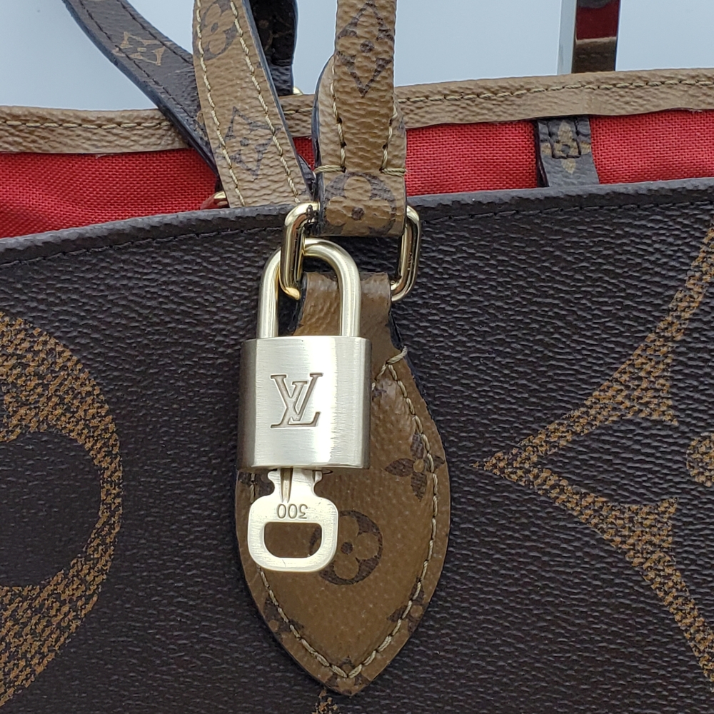 Authentic Louis Vuitton Gold Padlock In Excellent Shiny Brass 011426